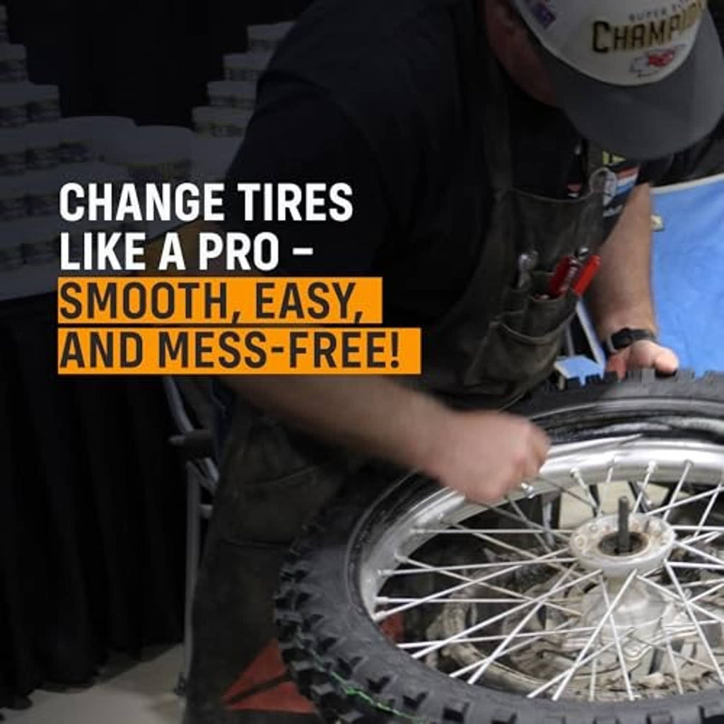 Tire changing soap jar and hands lubricating a bicycle tire with paste