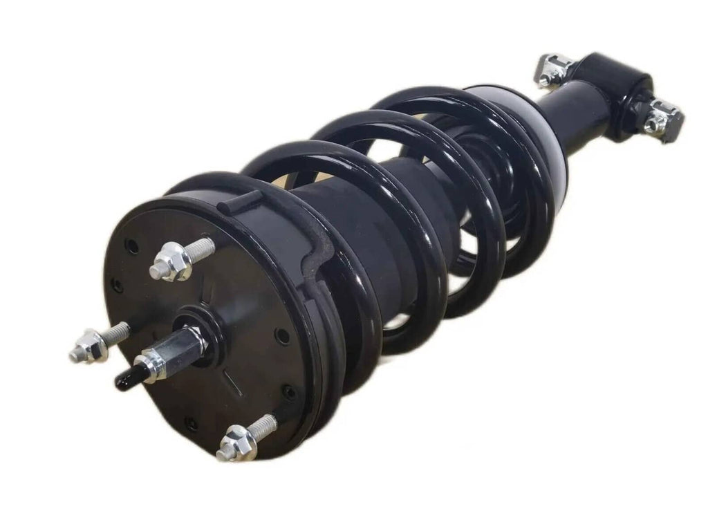 Black front shock strut with coil spring and metal mounting flange