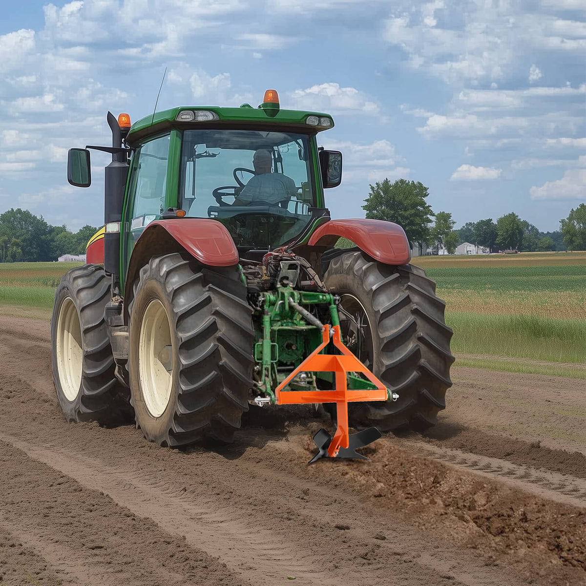 Orange middle buster quick hitch mounted on a tractor with black ground blade
