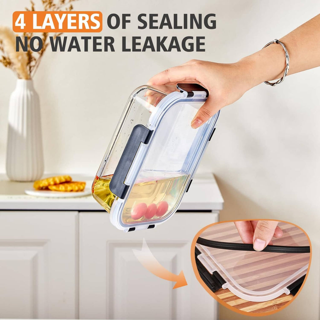Rectangular clear glass storage container with black latch and blue lid on counter