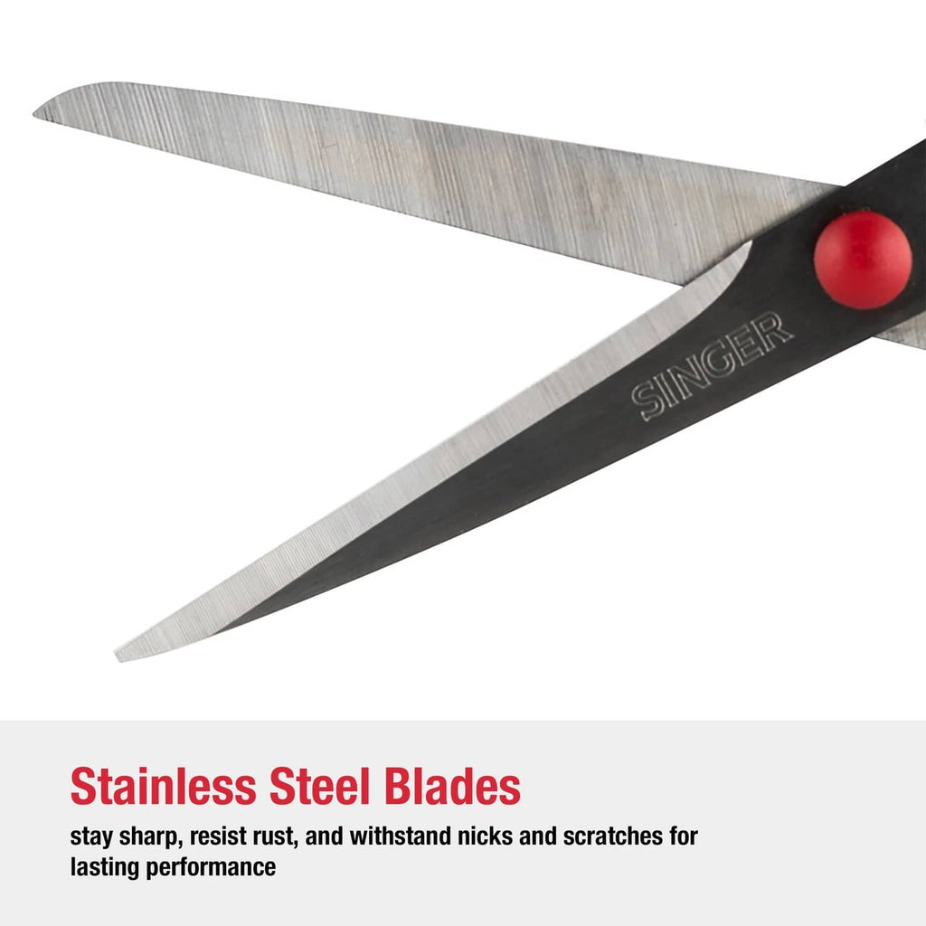 Singer scissors close-up showing stainless steel blades with red button pivot
