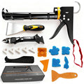 Caulking gun kit with black barrel, yellow accents, handle, and smoothing accessories