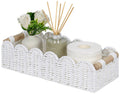 White woven scalloped toilet paper storage basket with two wood handle grips