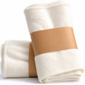 White cotton flannel castor oil pack wraps, rolled pair with stitched edges