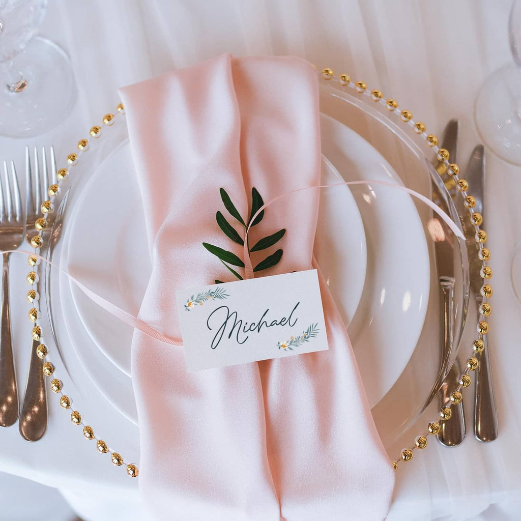 White place card on folded napkin at a table setting