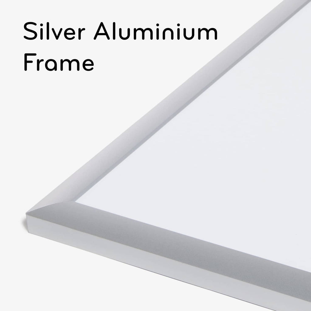 Silver aluminum frame corner of a white dry erase board