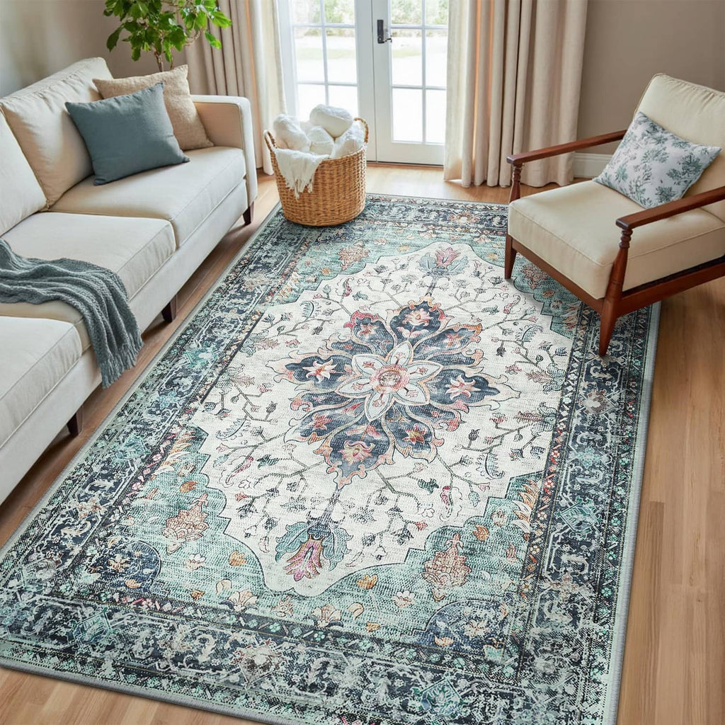 Rectangular washable area rug with teal, white, and navy ornate pattern medallion