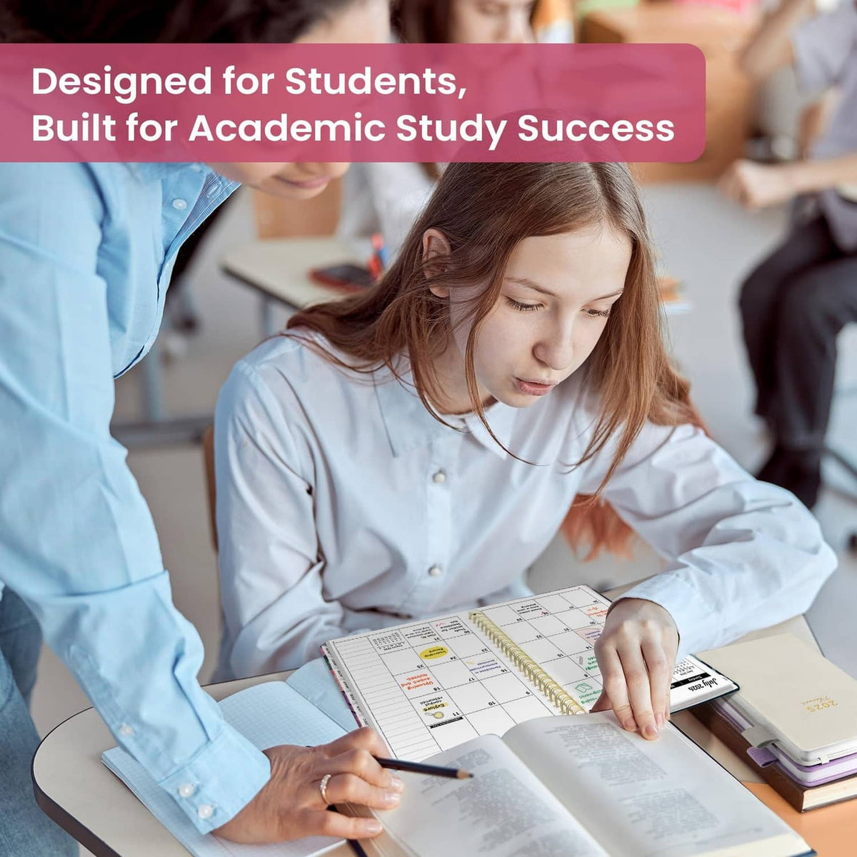 Student writing in an academic planner on a desk