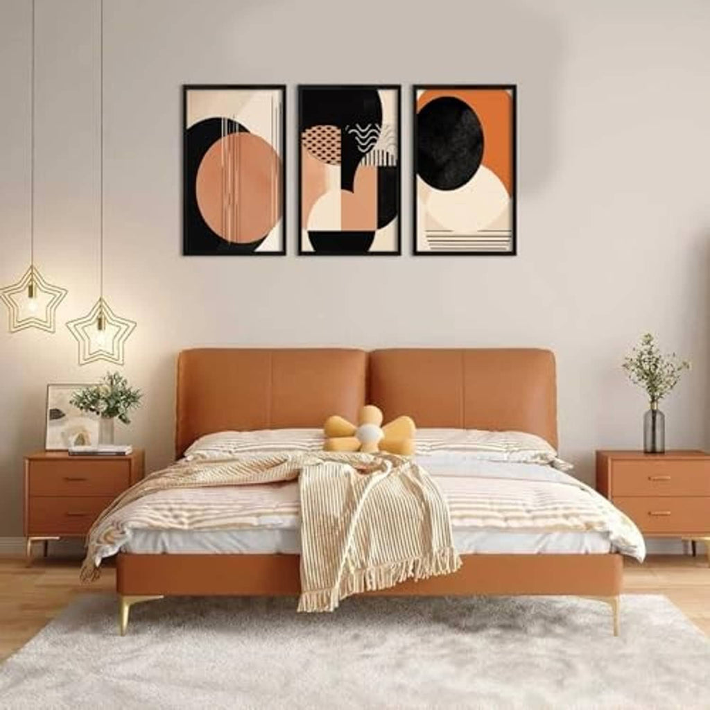 Black 16x20 picture frames mounted on wall above a bed
