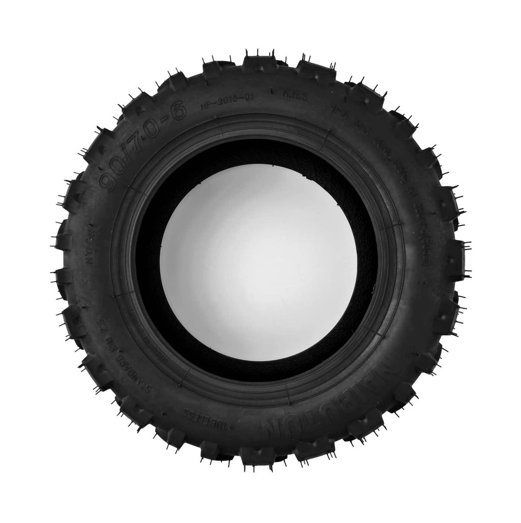 Black off-road tubeless tire with thick tread blocks and spiked sidewall
