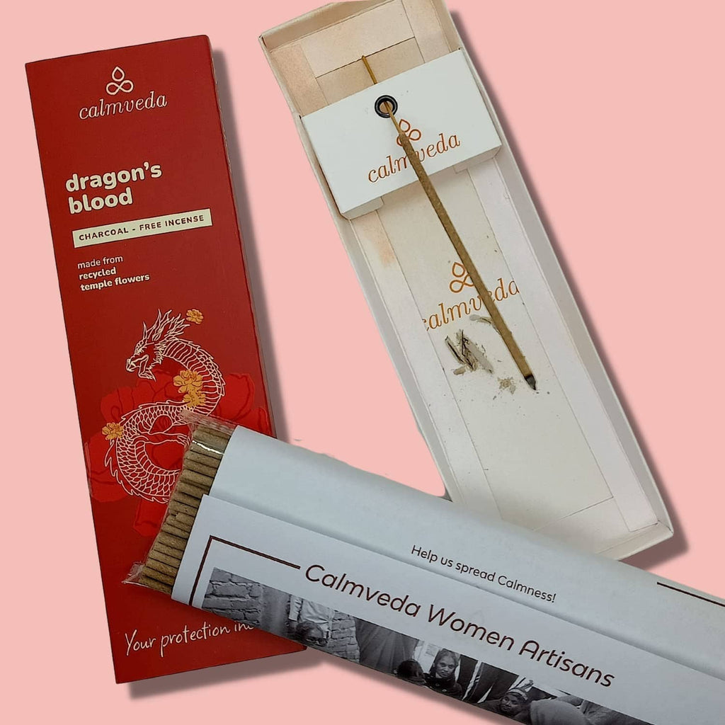 Dragon’s blood incense sticks box beside decorative holder set with Calmveda labels