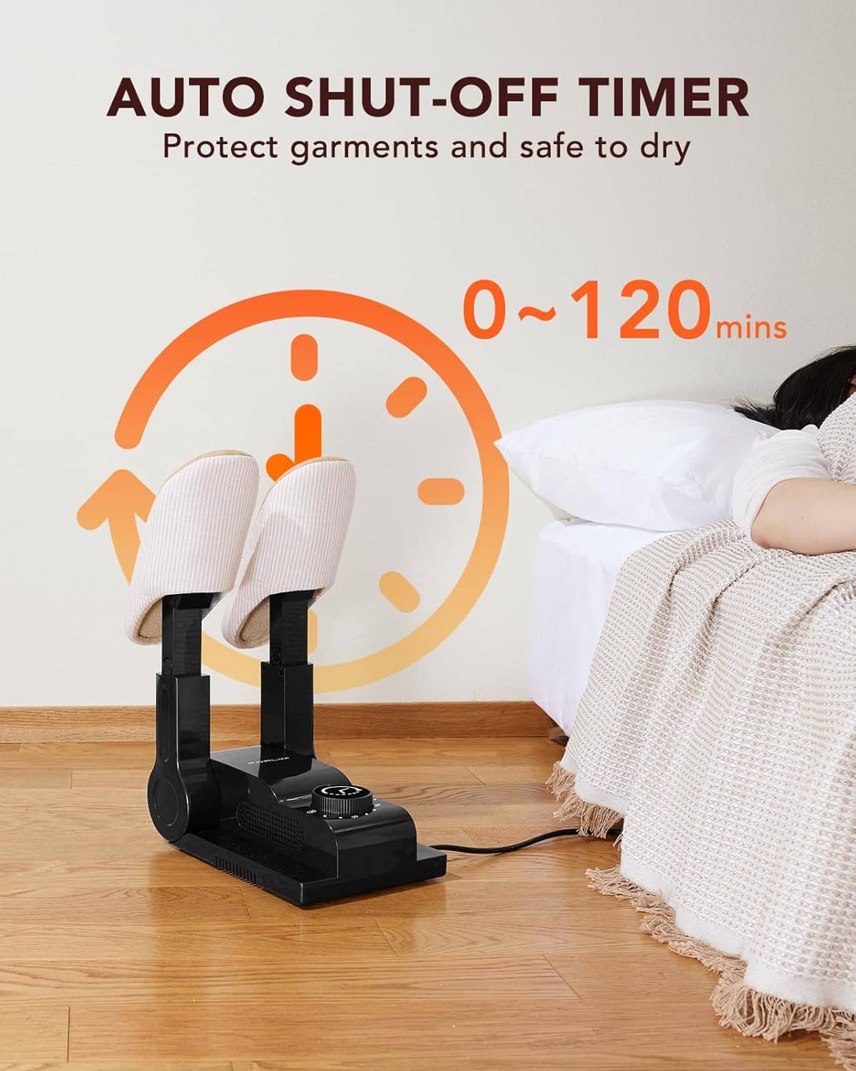 Boot dryer with auto shut-off timer setting, arms aimed toward socks on blanket