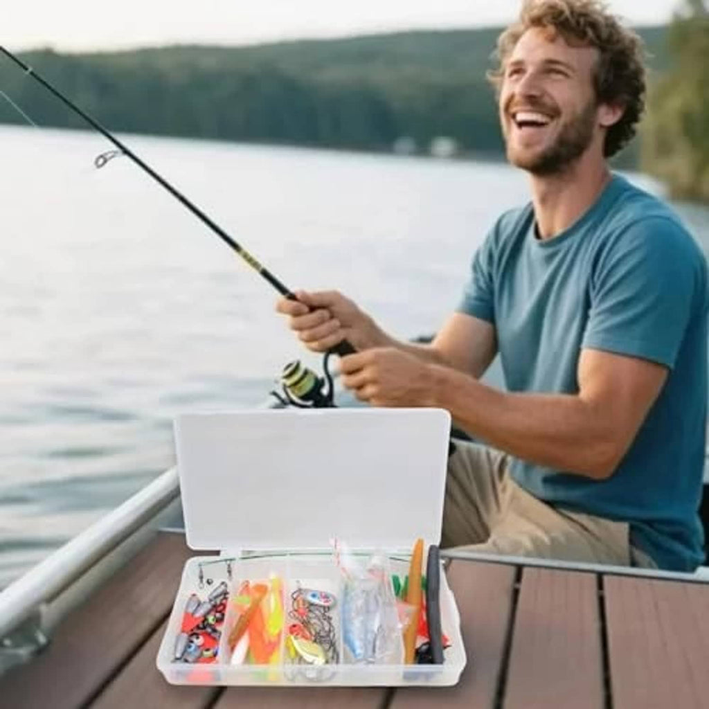 Open fishing lure tackle box on boat dock with assorted colorful baits
