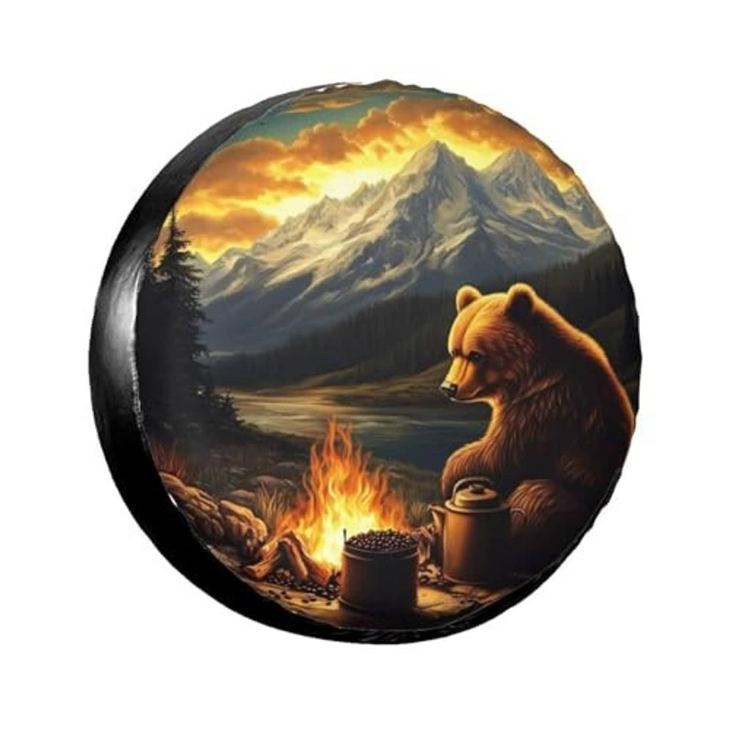 Black circular spare tire cover featuring a bear and mountain campfire