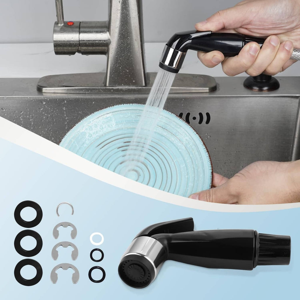Matte black faucet sprayer attachment releasing water toward sink
