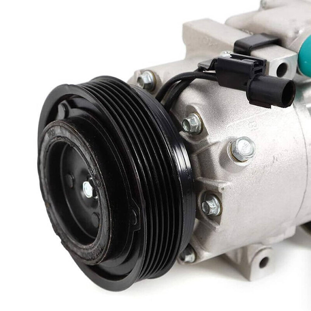 A/C compressor with clutch, close-up of black pulley and silver compressor housing
