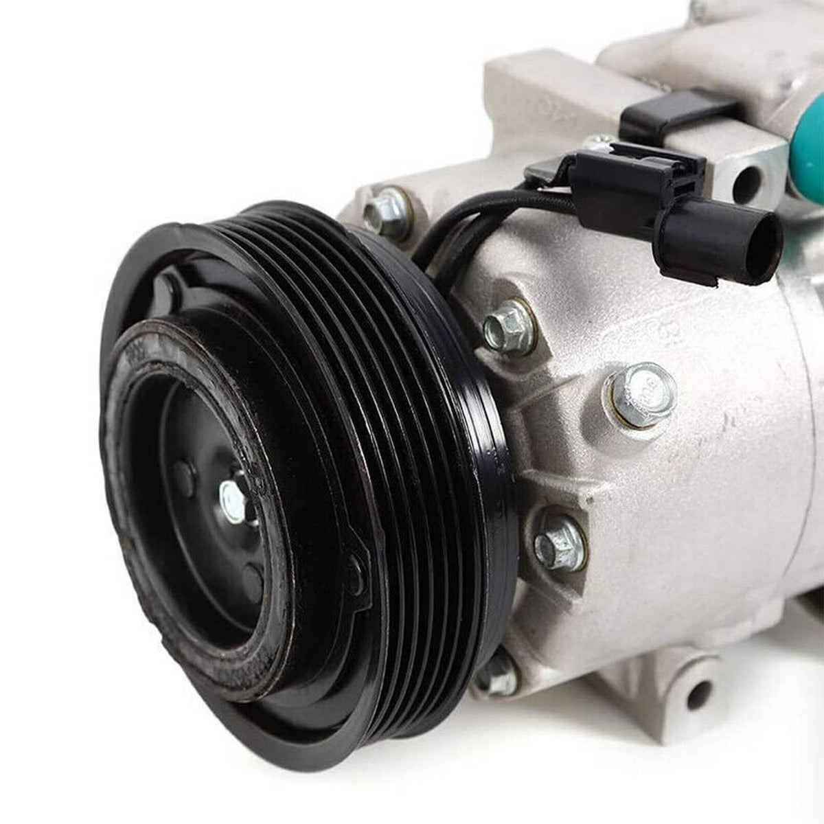 A/C compressor with clutch, close-up of black pulley and silver compressor housing