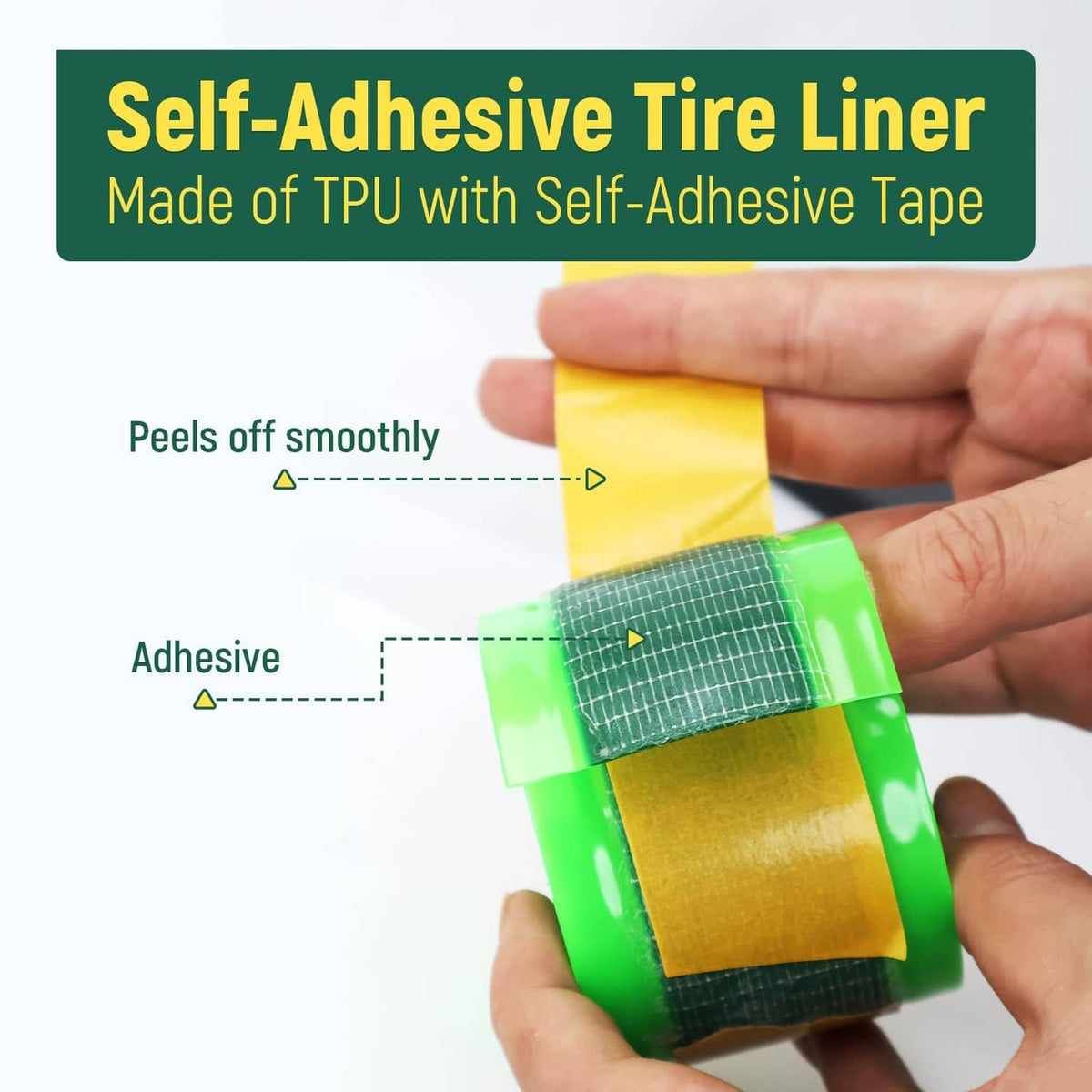 Green fat bike tire liner strip with self-adhesive backing held in hand
