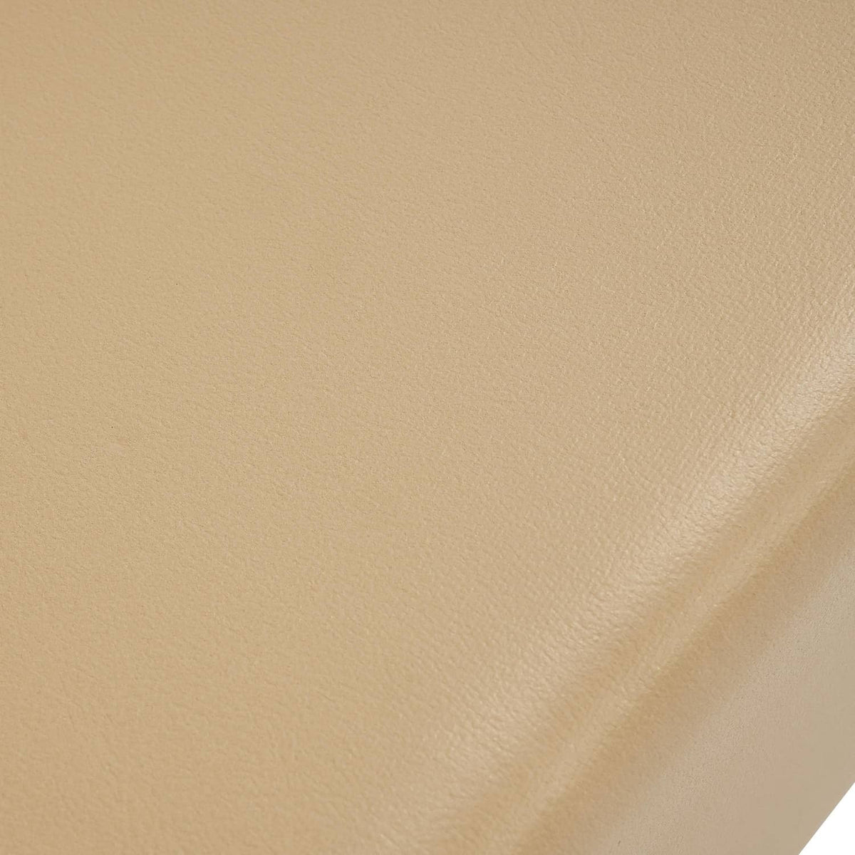 Tan seat base surface with smooth, fine-grain texture