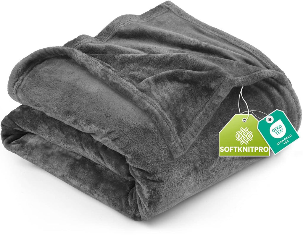 Grey fleece blanket folded, soft plush texture with neatly stacked edges.