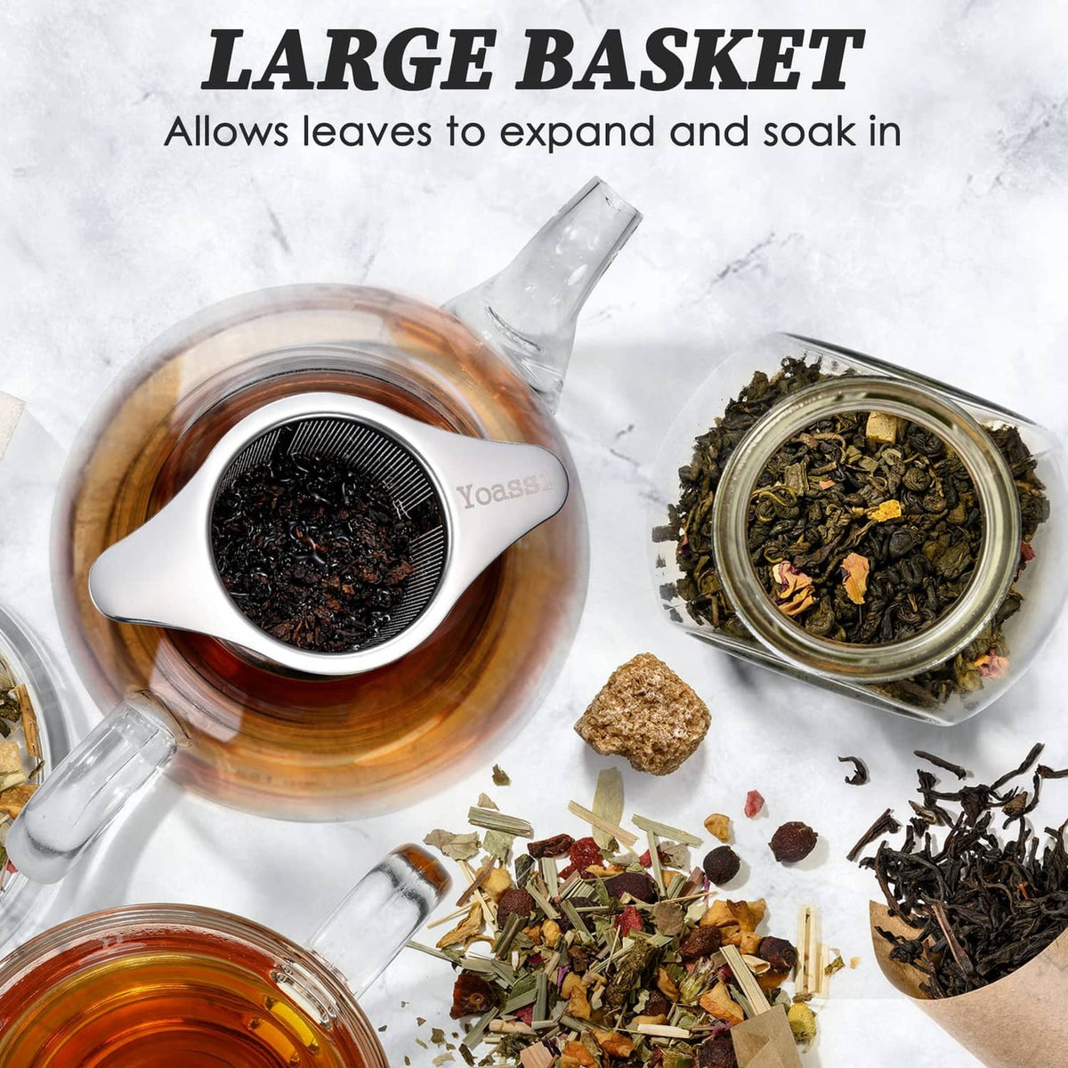 Stainless steel tea infuser basket placed over tea cup, fine mesh screen