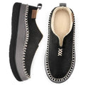 Men's black moccasin slippers with plush lining and chain-stitch trim