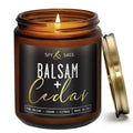 Amber glass soy candle jar with gold lid open and small flame