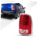 Right passenger tail light assembly with red lens and clear reflector, chrome trim.
