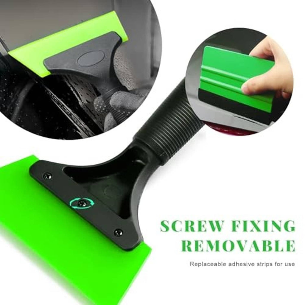 Window film squeegee tool with green blade removing film from a glass surface