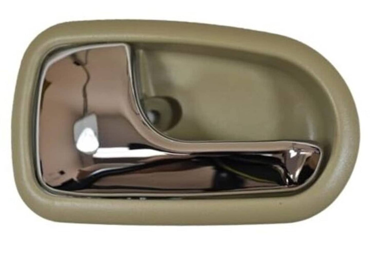 Beige interior door handle housing with chrome lever inside a rectangular bezel