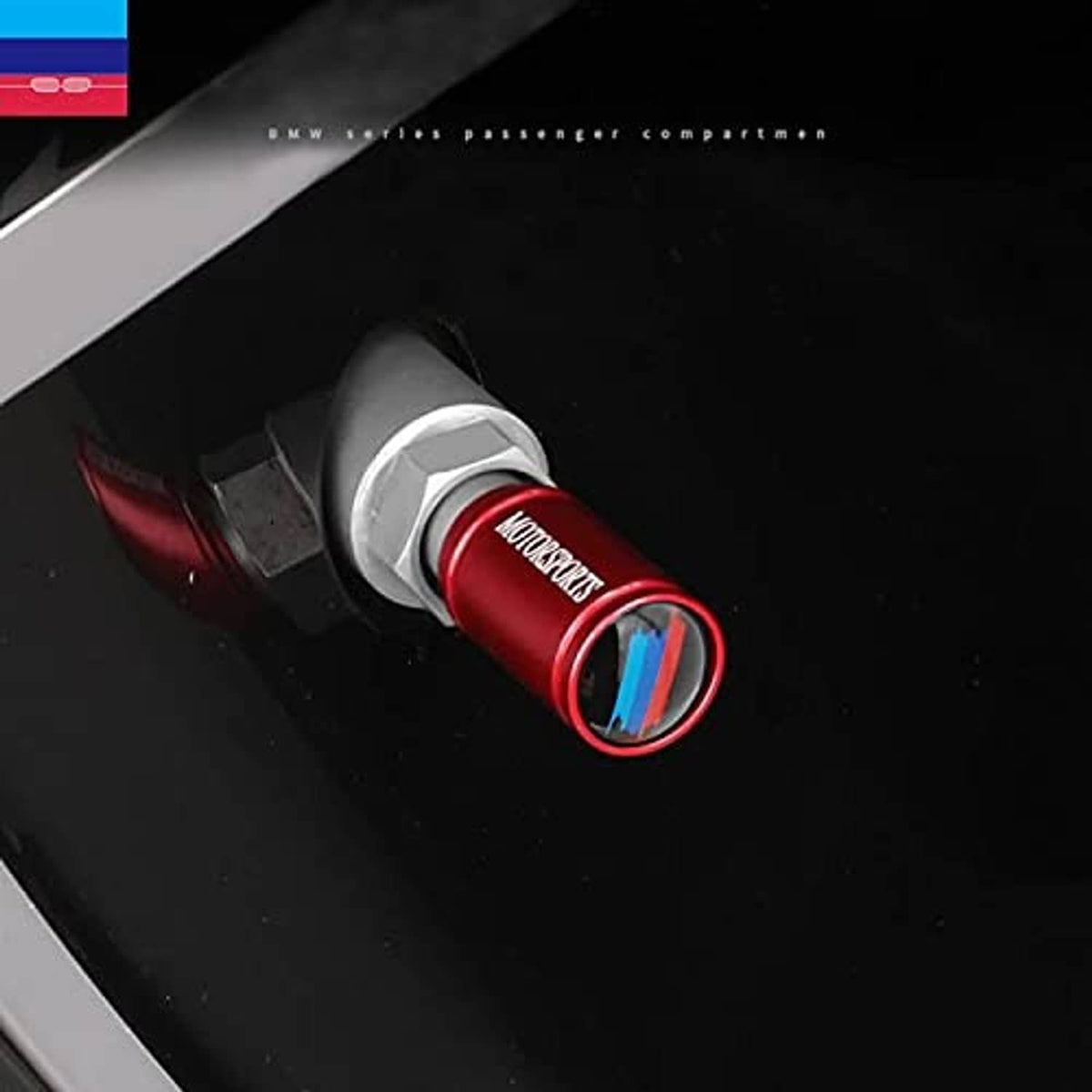 Red valve stem cap on dark wheel area, blue stripe insert visible