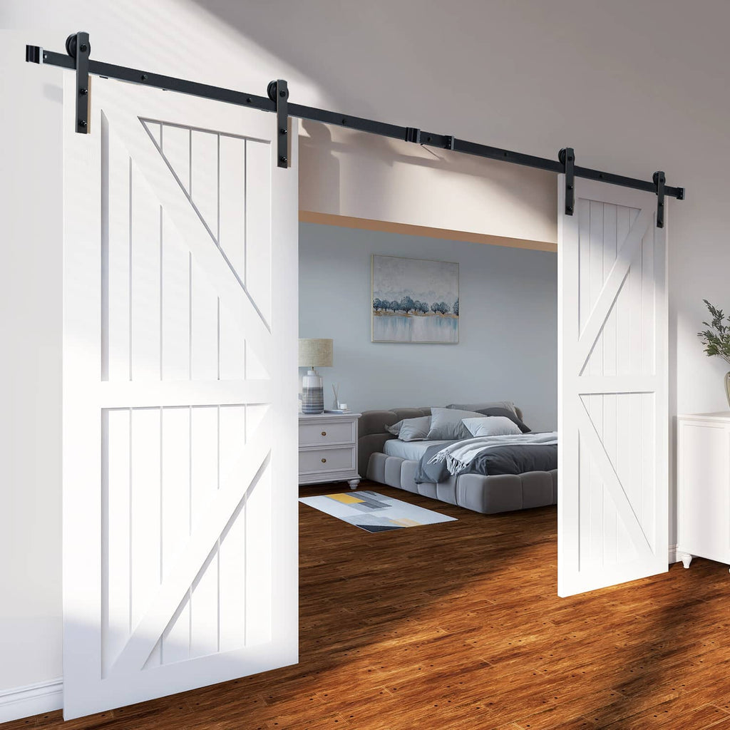 Black sliding barn door track mounted above two white paneled doors