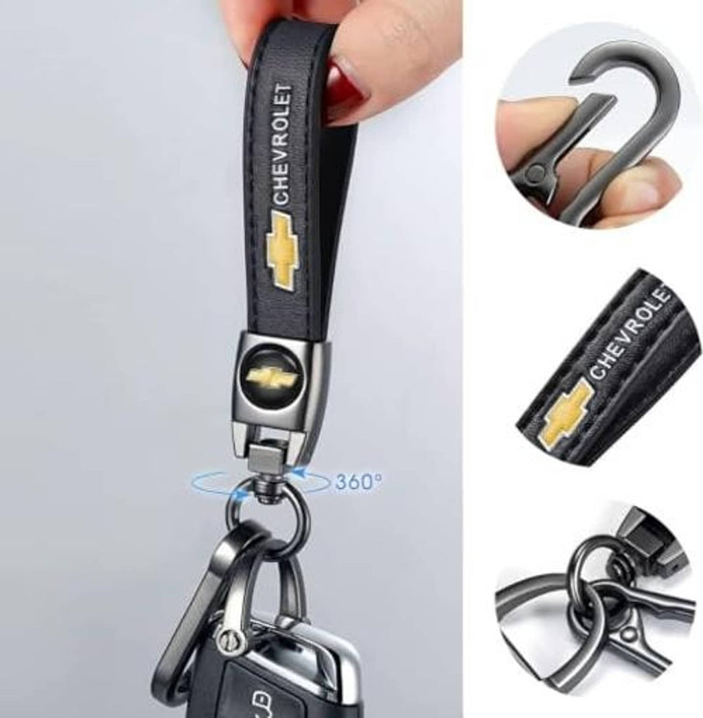 Black leather key chain with Chevrolet logo, hand holding with 360° rotating clip