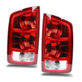 Pair of red rear tail light assemblies with clear lower sections