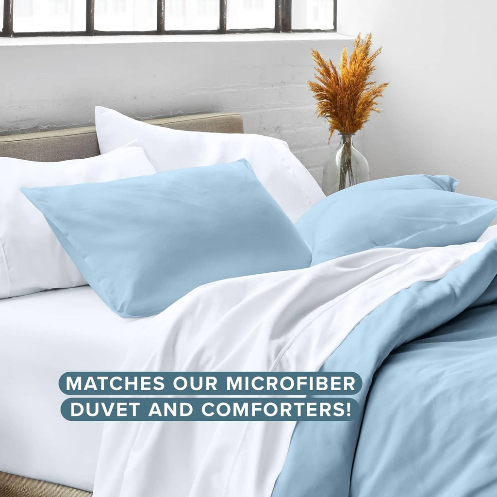 Light blue microfiber pillow shams on bed with coordinated bedding, set of 2.