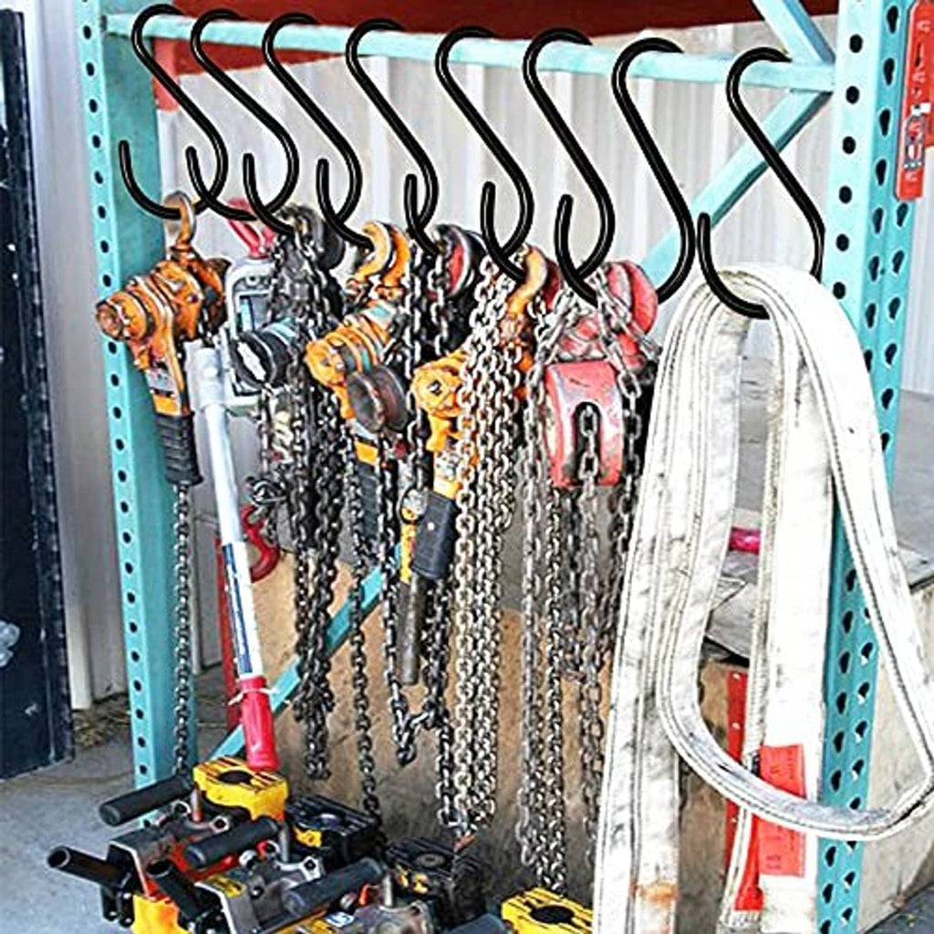Black S hooks hanging from a metal rack, curved hooks for chains and accessories