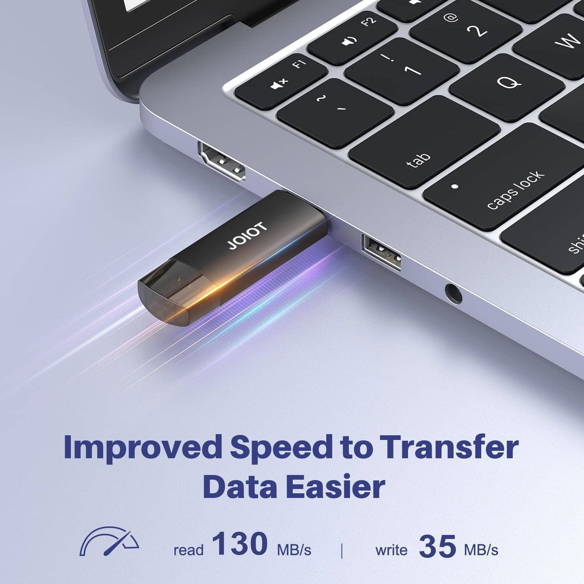 Dual USB flash drive showing Type-C connector insertion beside laptop keyboard