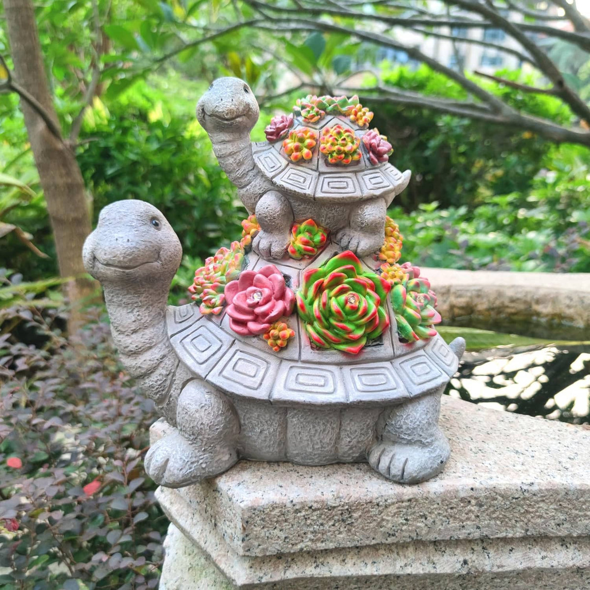Solar tortoise garden lantern statue with multicolor succulent-style flower display