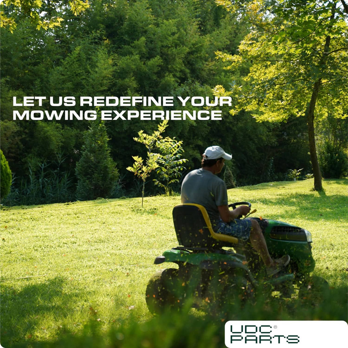 Riding lawn mower cutting grass outdoors with operator