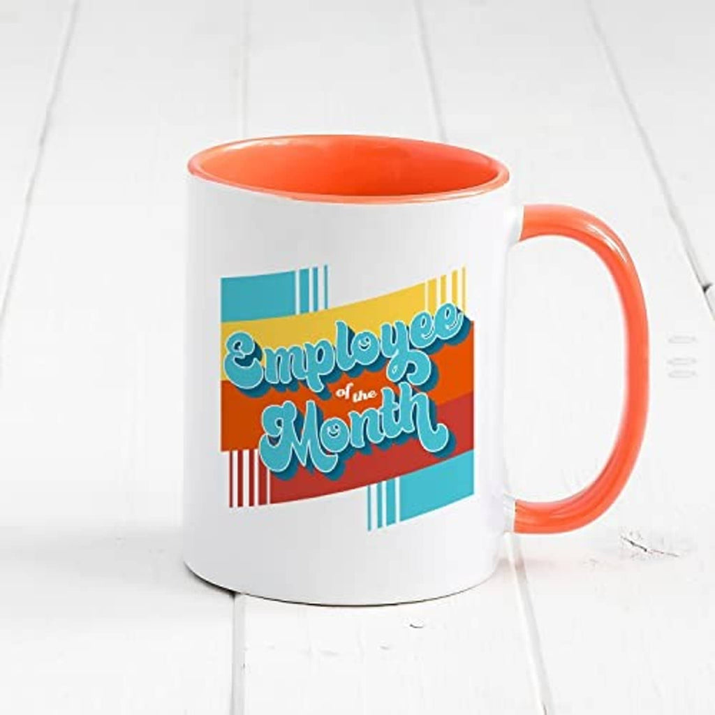 White ceramic mug with orange interior and handle, 'Employee of the Month' print