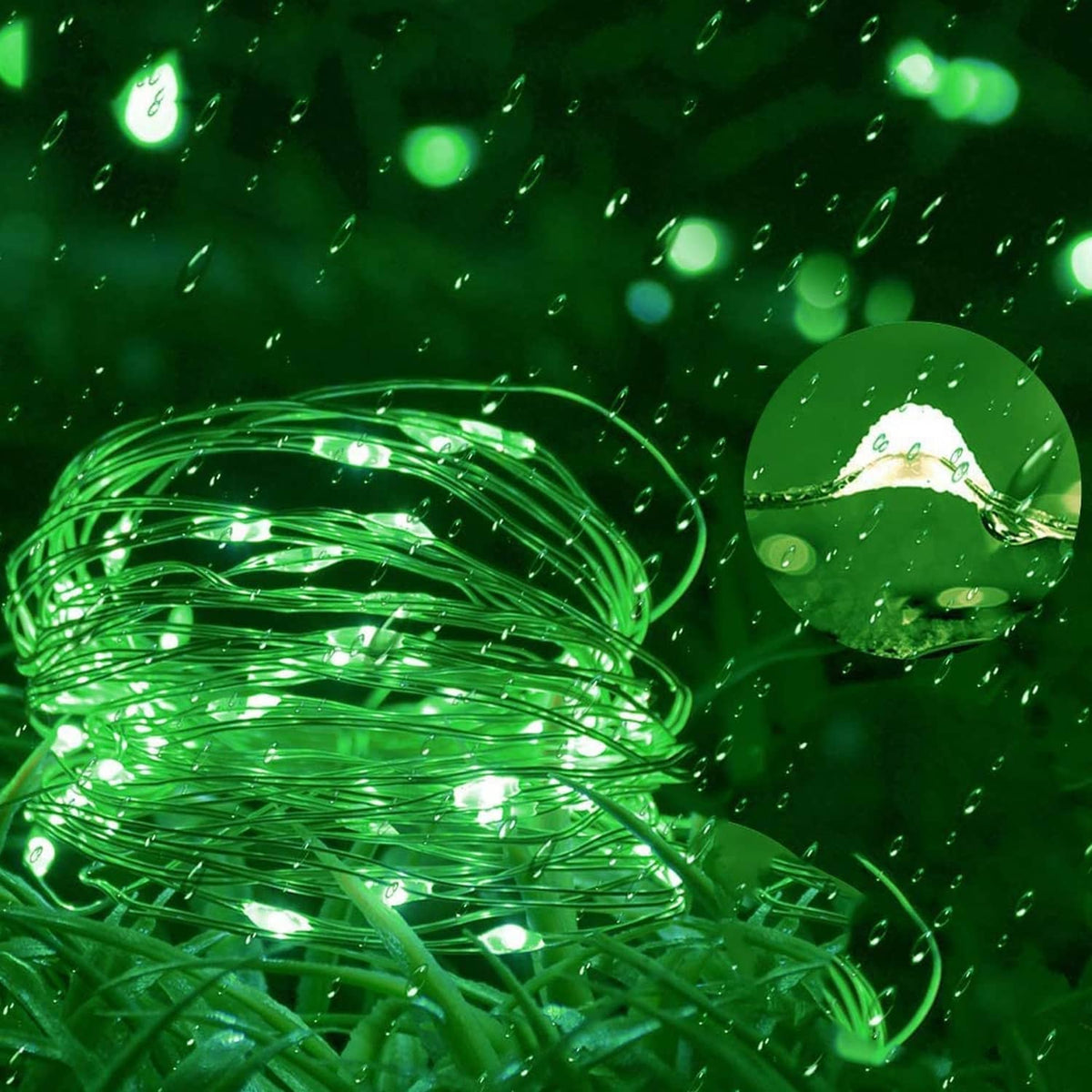 Close-up of green LED fairy light wire with water droplets