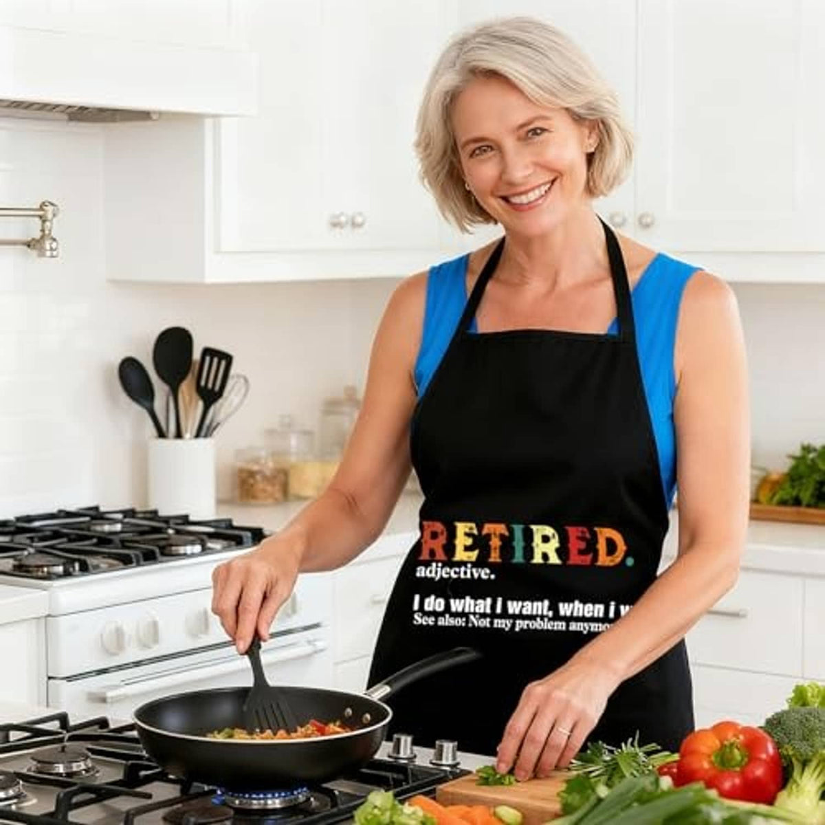Black sleeveless apron worn by woman with 'RETIRED' slogan on the front
