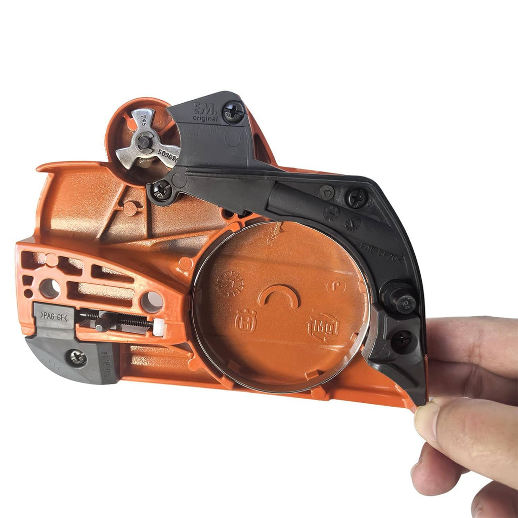 Chainsaw clutch cover with brake, orange and black side view held by hand