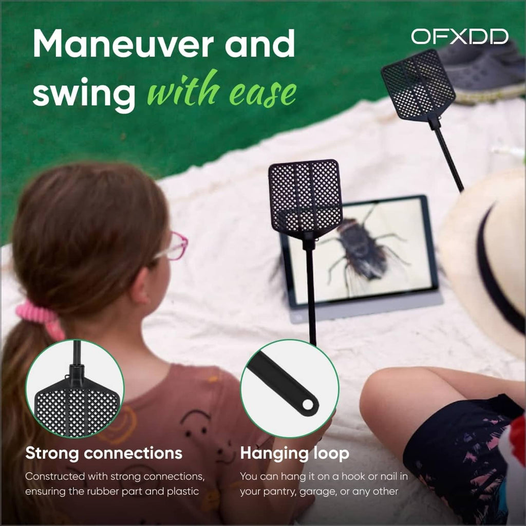 Black rubber fly swatter with perforated paddle head on a long handle
