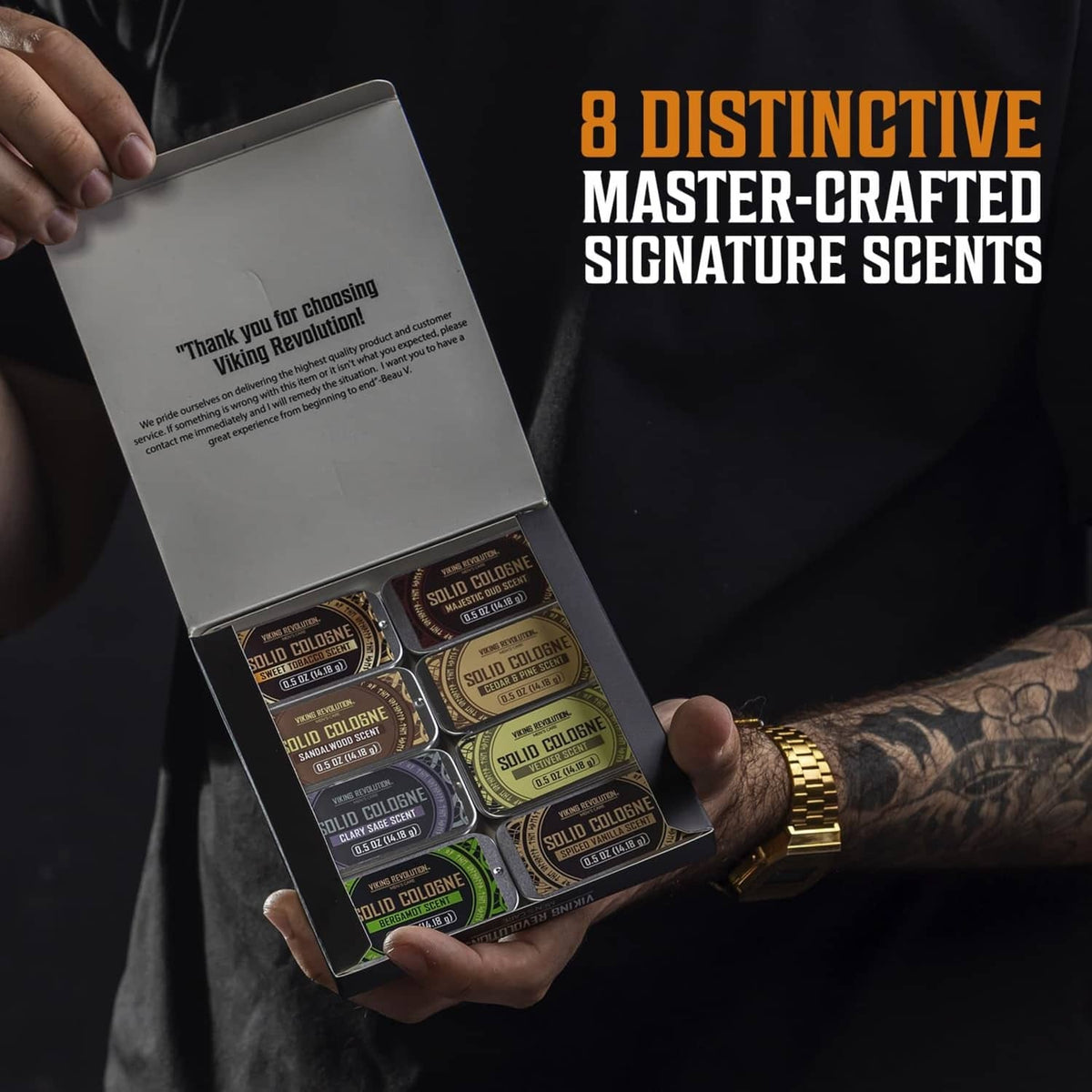 Person holding solid cologne variety 8-pack box with small tins inside