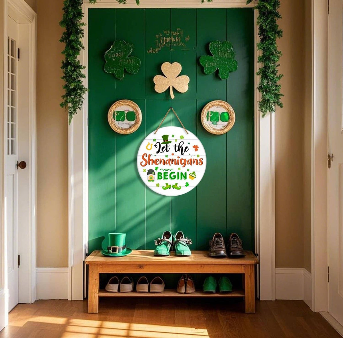 Round hanging door sign with “Let the Shenanigans Begin” text on an entry wall