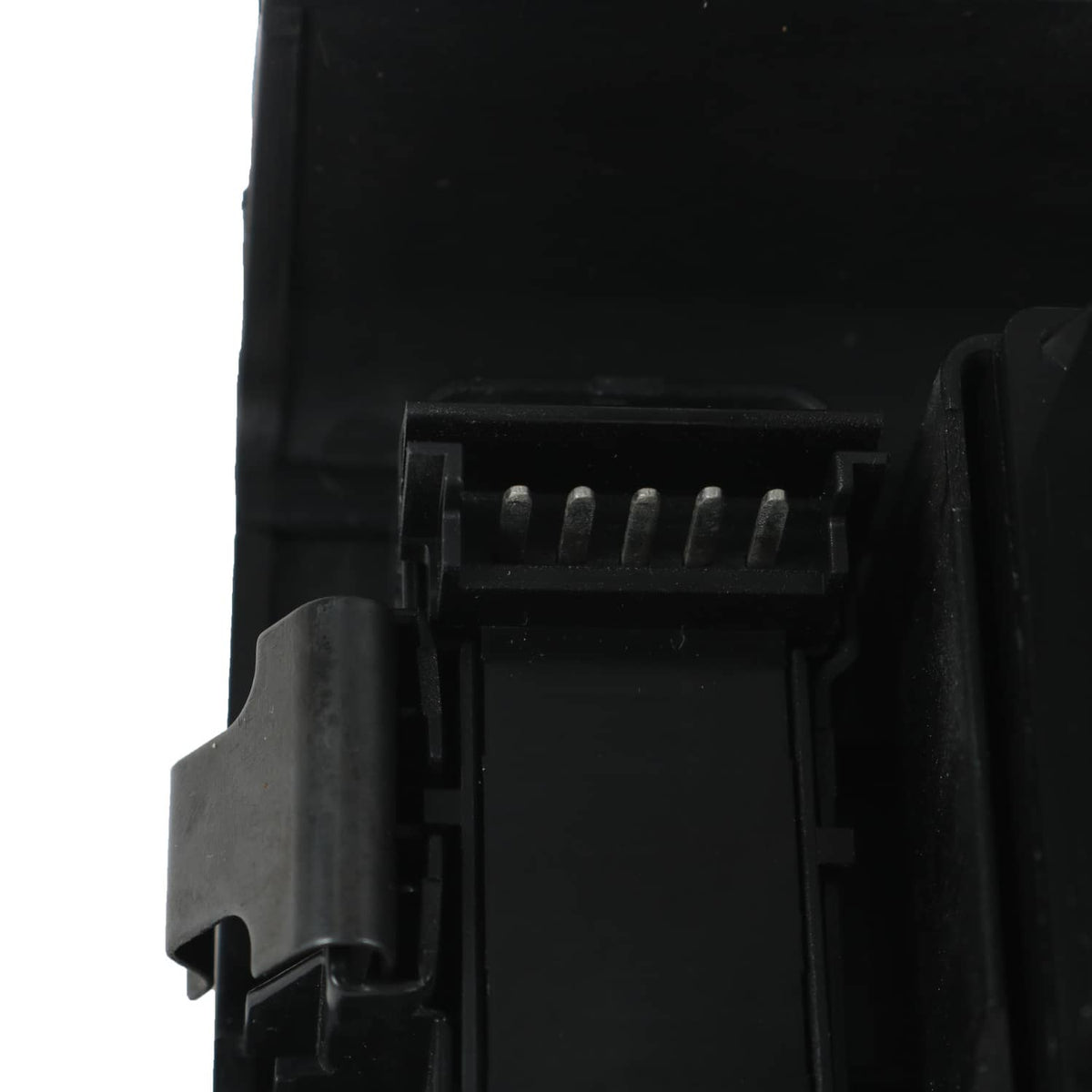 Power window switch housing with exposed electrical connector pins