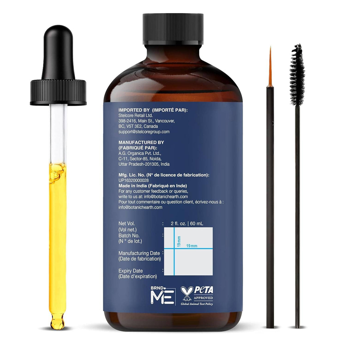 Rosemary hair oil bottle with black cap, dropper and brush applicator shown next to it