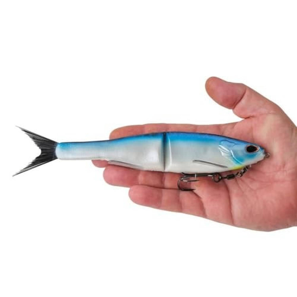 Blue and silver glide bait in hand with treble hook on underside