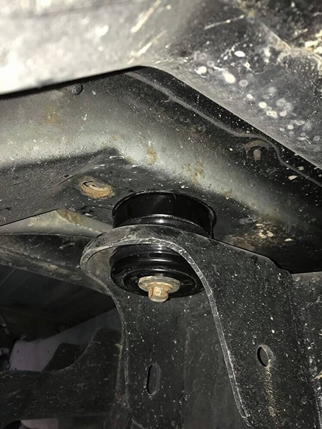 Installed black body mount bushing with red silicone ring and mounting bolt